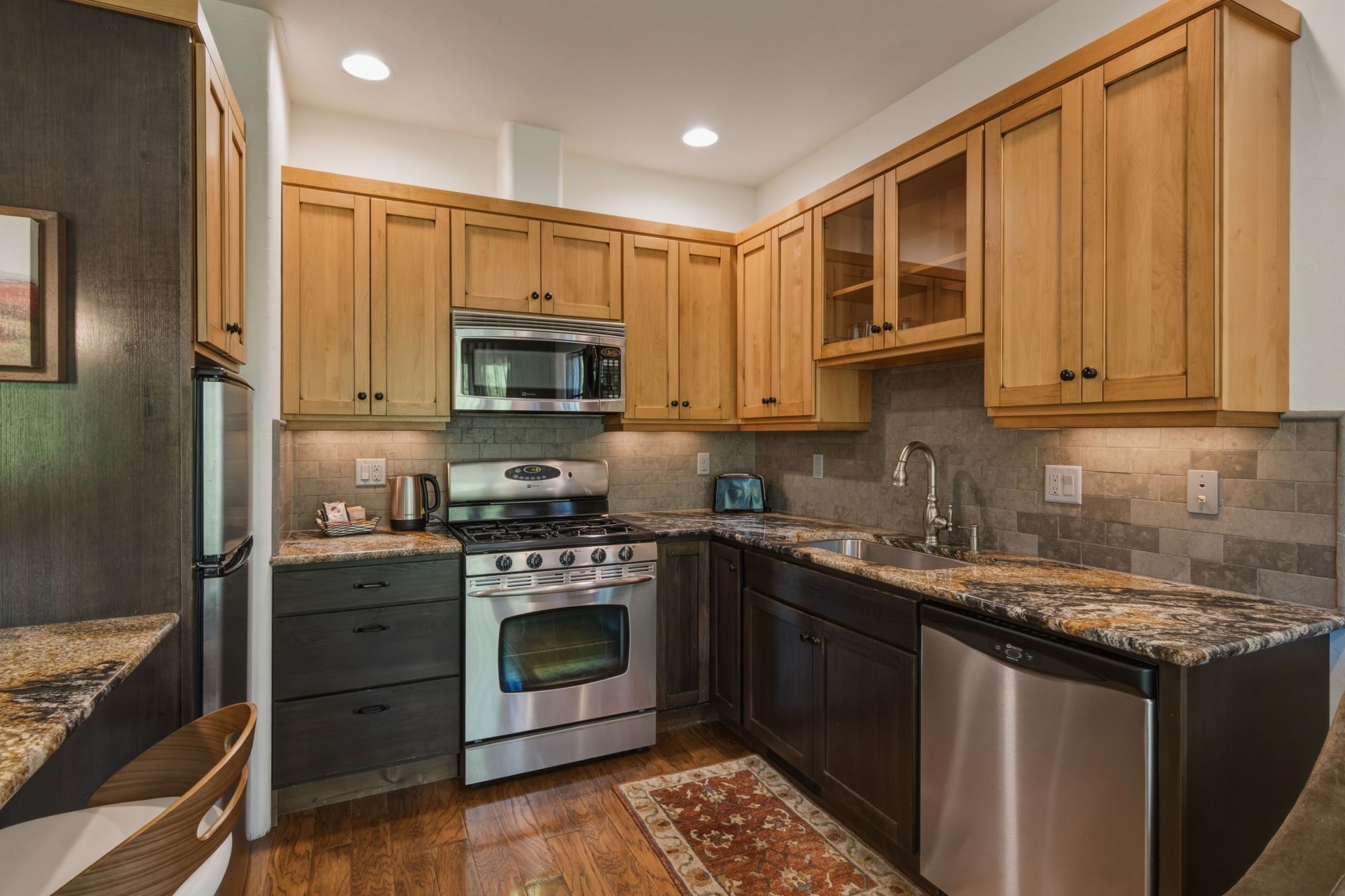 Carriage House full kitchen with amenities such as fridge, oven, dishwasher