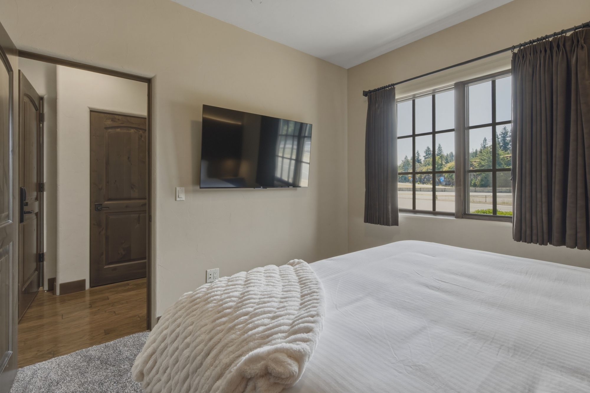 Carriage House flatscreen TV in bedroom